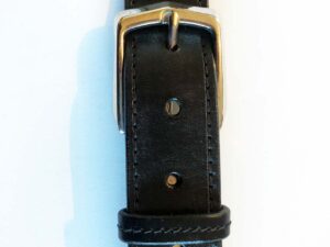 Black leather belt, machine stitched, brass buckle